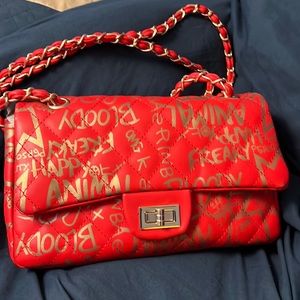 Red and gold graffiti shoulder bag